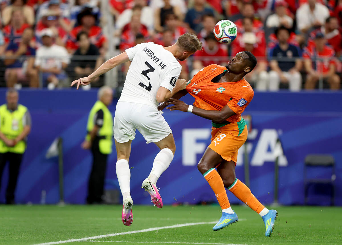 Norway defender Kristoffer Ajer (3) and Ivory Coast forward Ange-Yoan Bonny compete for possession during the 2026 FIFA World Cup knockout match on Tuesday, June 30, 2026, at Dallas Stadium in Arlington.